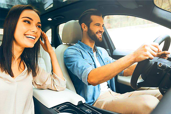 Photo of Happy Couple in New Car